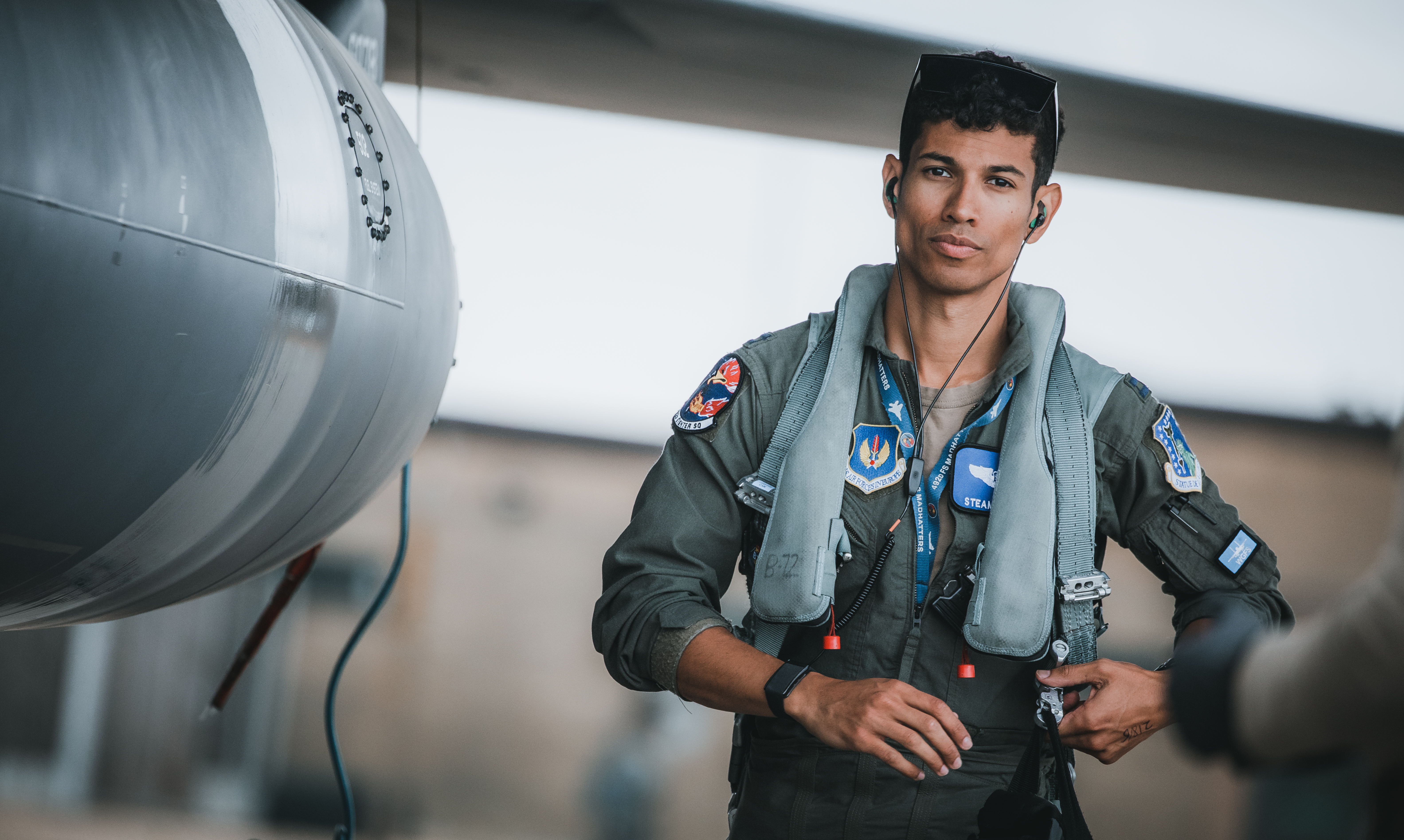Image shows United States Air Force airman by his aircraft.